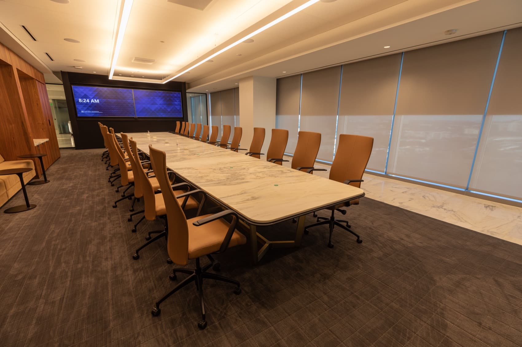FIS World Headquarters — boardroom with motorized roller shades drawn across the full window wall