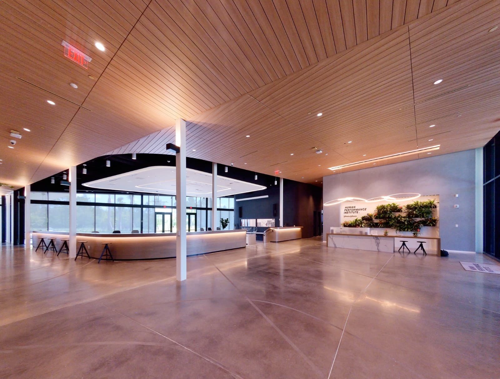 Johnson & Johnson HPI — reception foyer under the warm wood ceiling