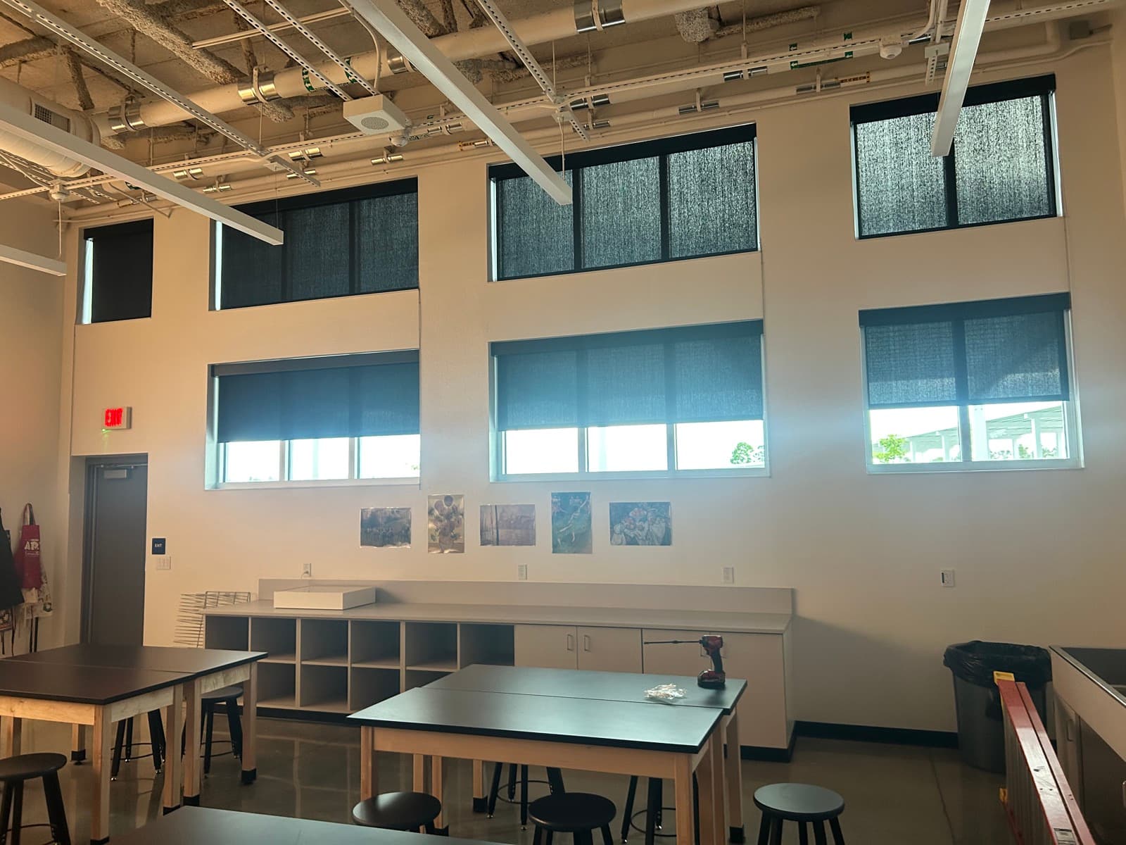 Wellen Park High School — double-height science classroom with RB500+ manual roller shades in 1% solar fabric, Sarasota, FL