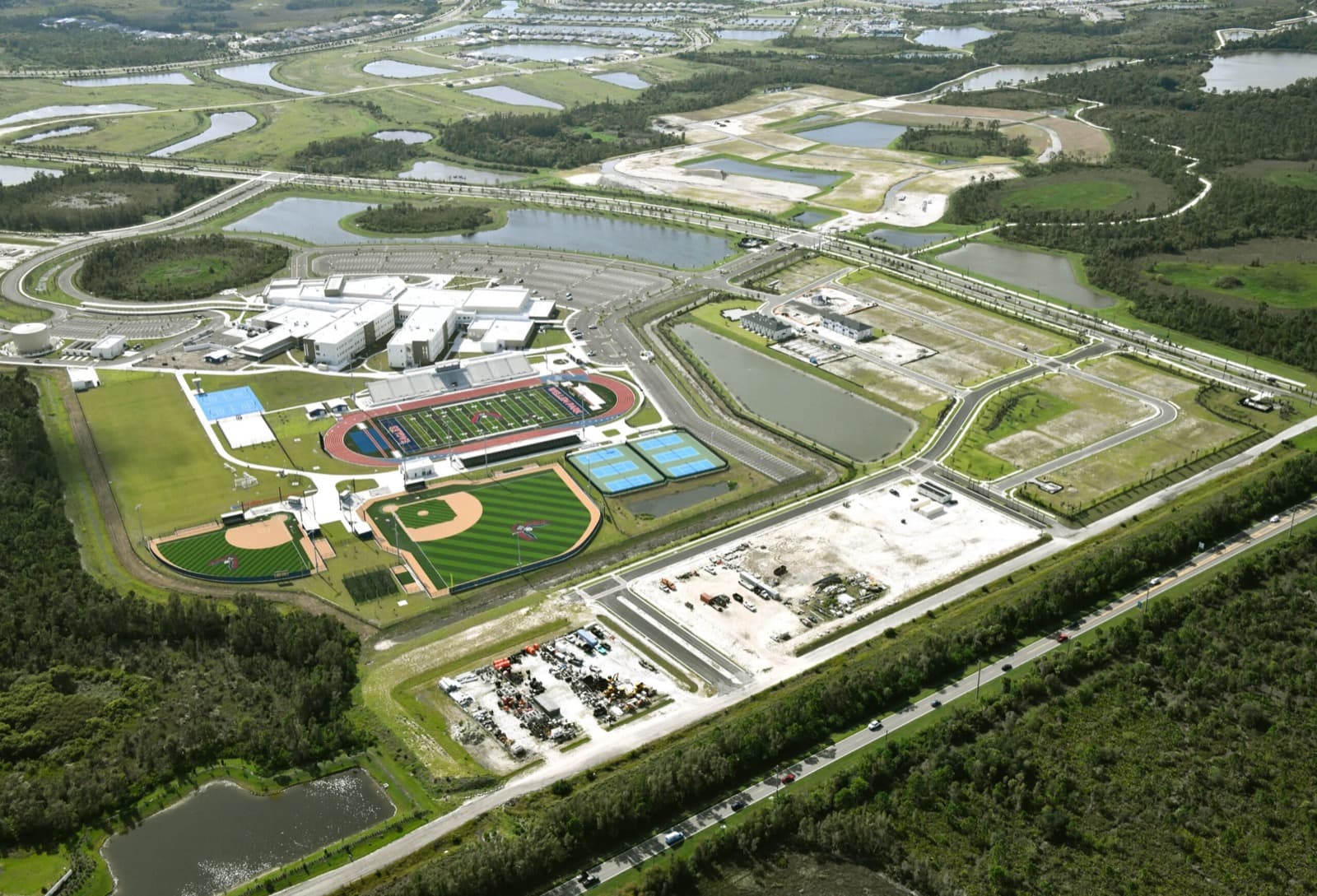 Wellen Park High School — aerial view of the 320,000 SF campus, athletic complex, and stadium, Sarasota, FL