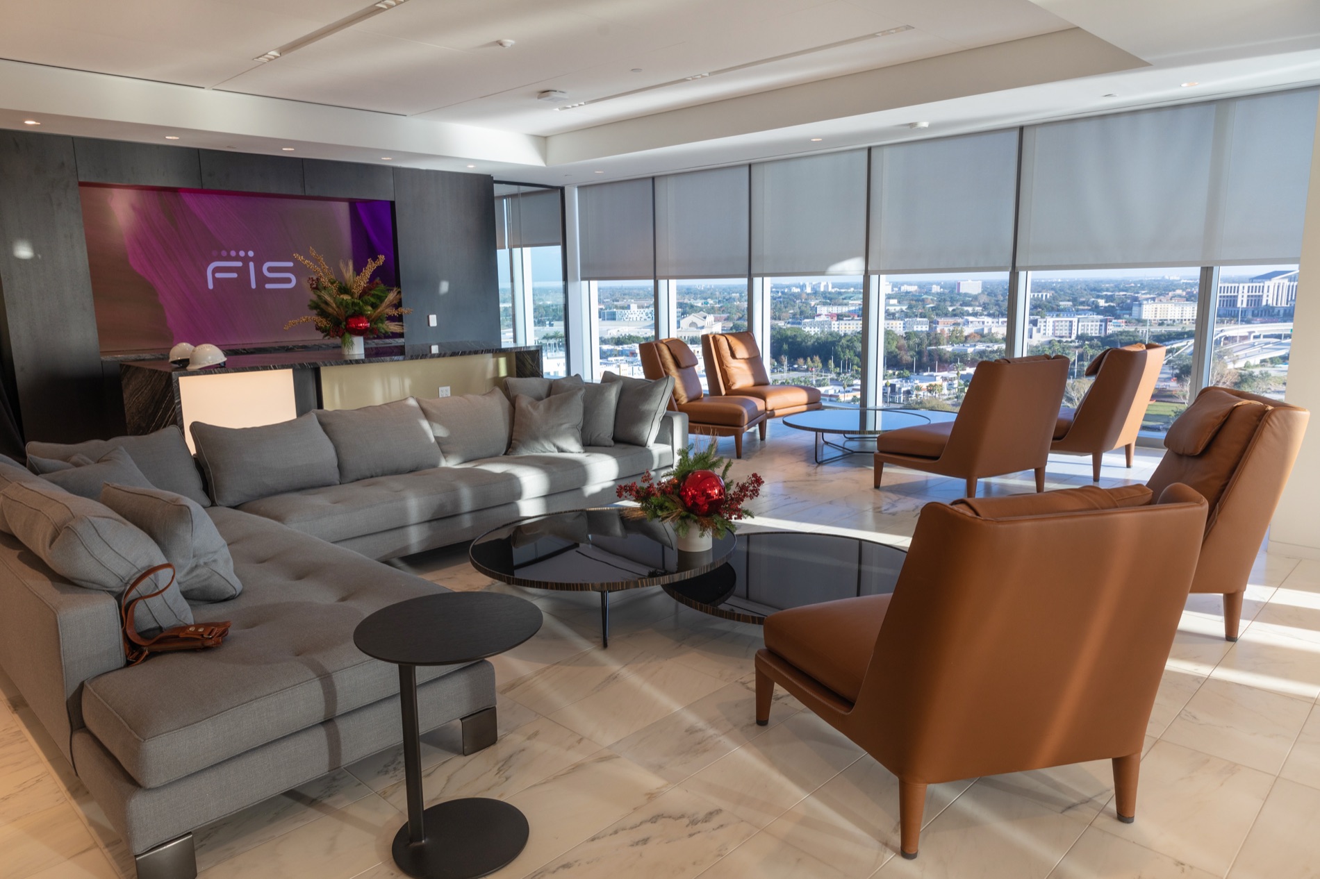 FIS World Headquarters — executive lounge with motorized roller shades and the Jacksonville skyline beyond, St. Johns River, FL
