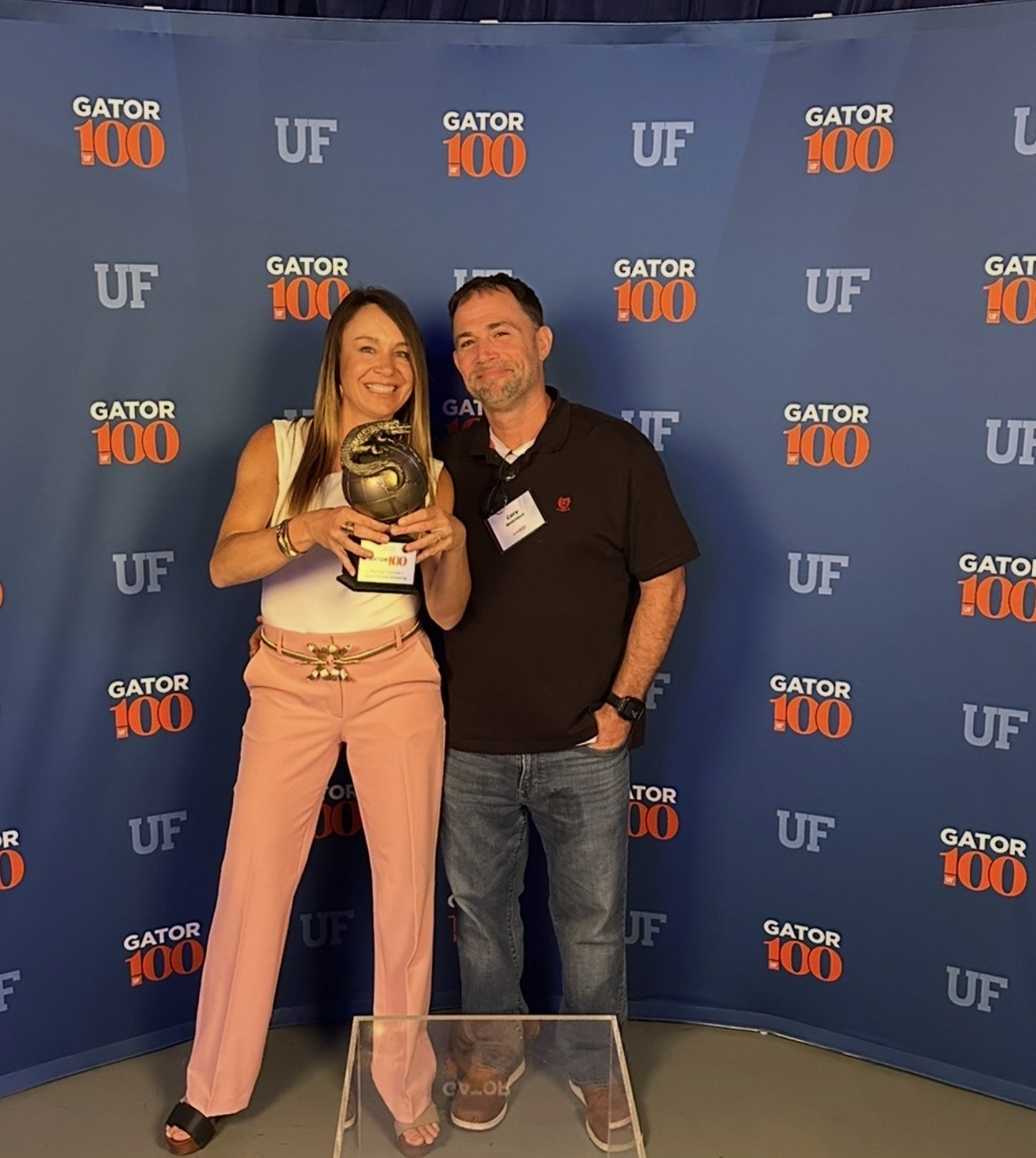 Megan and Cory Molyneux with the Gator 100 award at the University of Florida