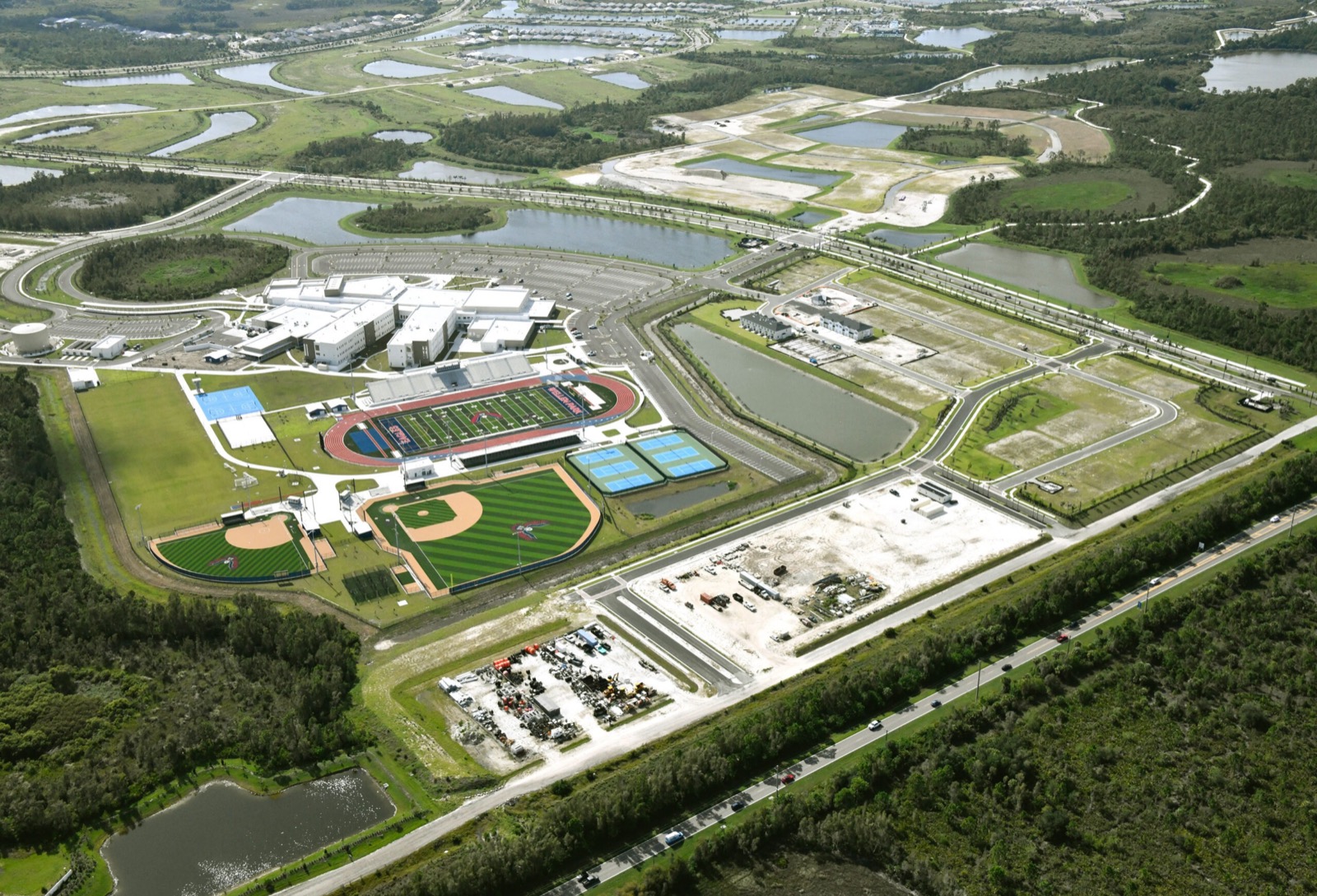 Wellen Park High School — aerial view of the 320,000 SF campus, athletic complex, and stadium, Sarasota, FL